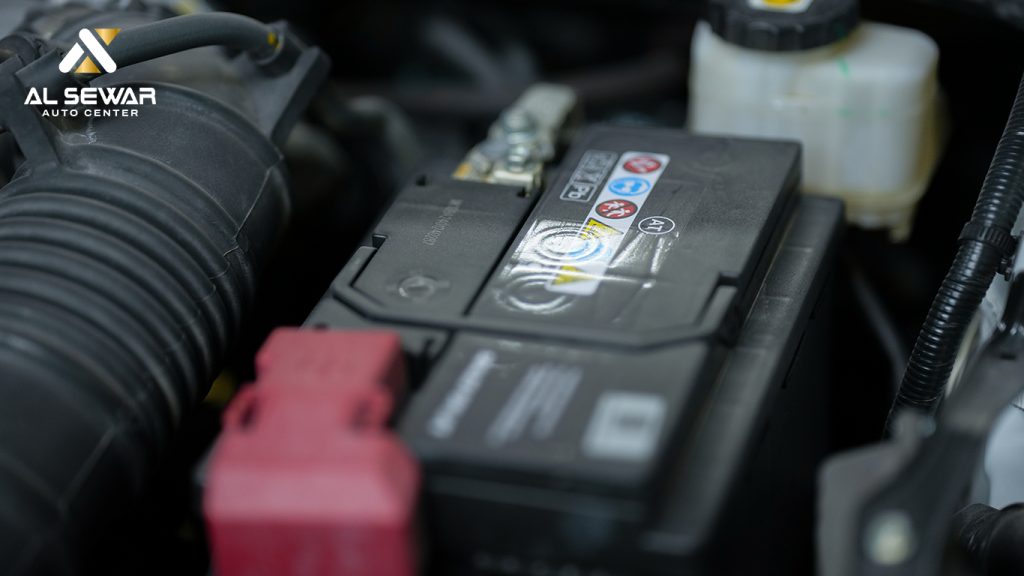 Mechanic inspecting a car battery under the hood, checking for corrosion and voltage issues.