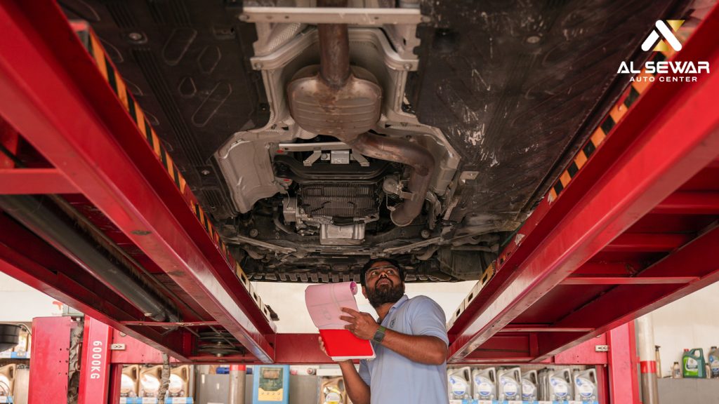 Mechanic performing a pre-trip vehicle inspection, checking car engine and fluid levels for road safety.