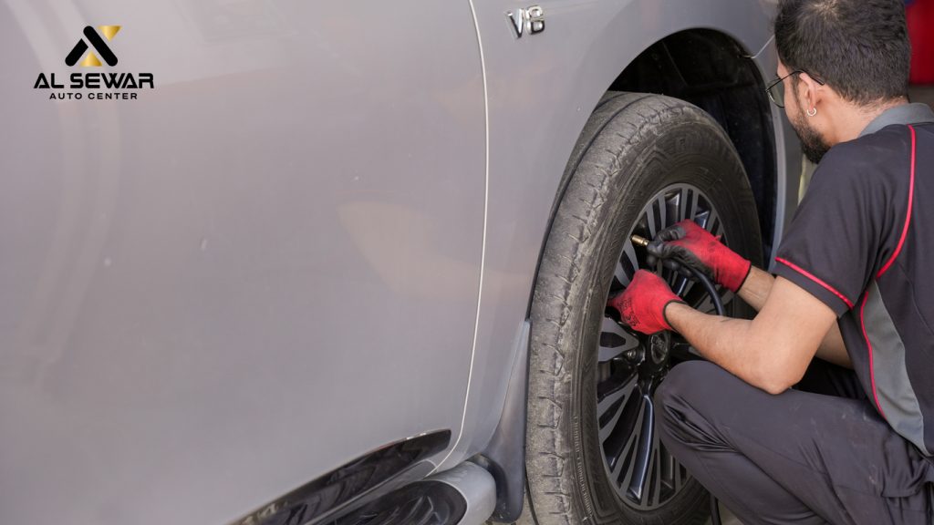 Technician performing nitrogen filling in car tires for better pressure retention at Al Sewar Auto Dubai.
