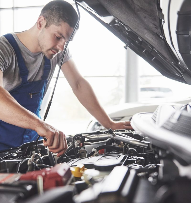 Auto mechanic working in garage. Repair service Auto mechanic working in garage. Repair service.